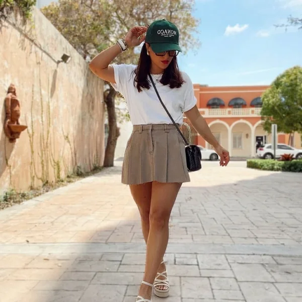 Taupe Pleated Mini Skirt with White Tee and Sporty Accessories