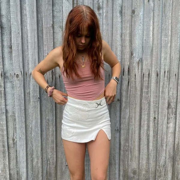 Asymmetrical Camisole and Embroidered White Mini Skirt