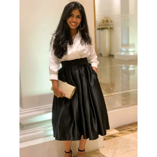 Pleated Black Satin Skirt and White Wrap Blouse