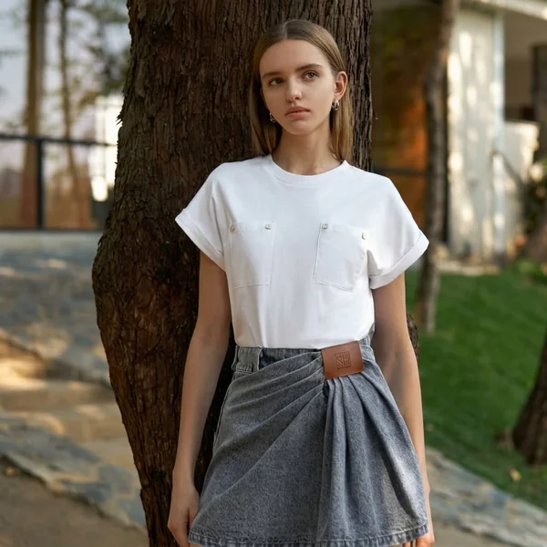 White Pocket Tee and Draped Grey Denim Skirt