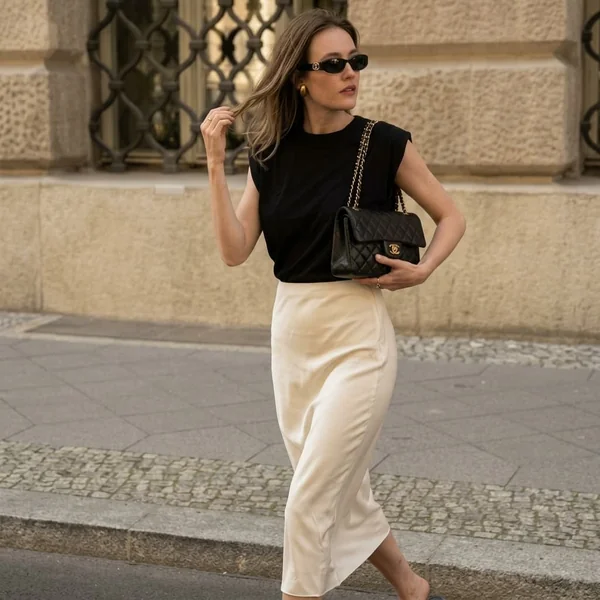 Strong Shoulders and White Satin Skirt