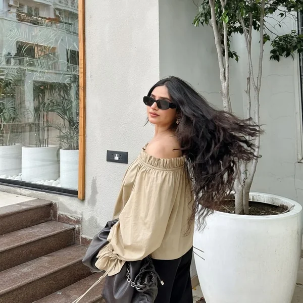 Ruffled Khaki Off-Shoulder Blouse with Black Trousers