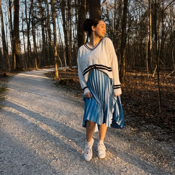 Cable-Knit Sweater and Blue Pleated Midi Skirt