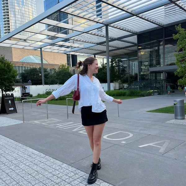Relaxed White Button-Down and Black Mini Skirt