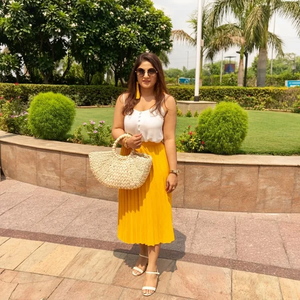 White Button-Front Cami and Yellow Pleated Skirt