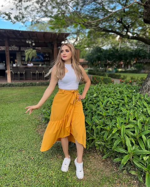 White Cutout Crop Top and Mustard Wrap Maxi Skirt