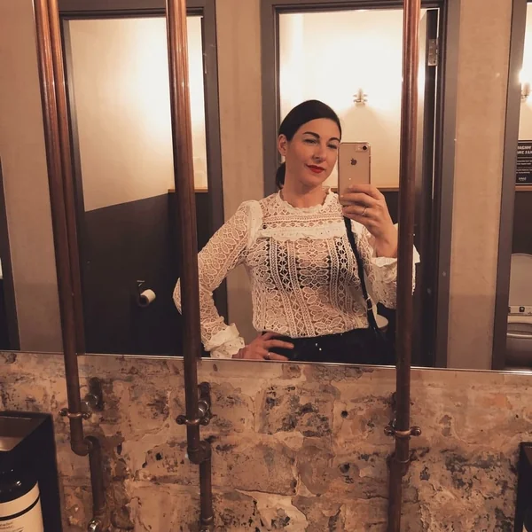 White Eyelet Lace Top with Black Trousers