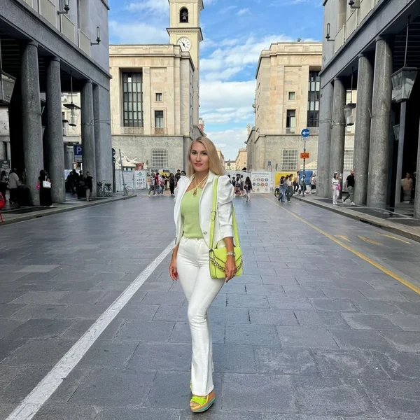 Pistachio Halter Top with White Blazer and Flared Jeans