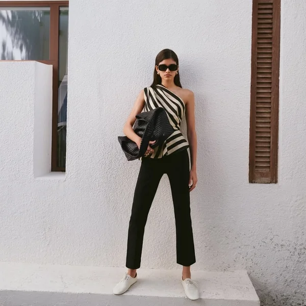 Striped Asymmetric Peplum Top