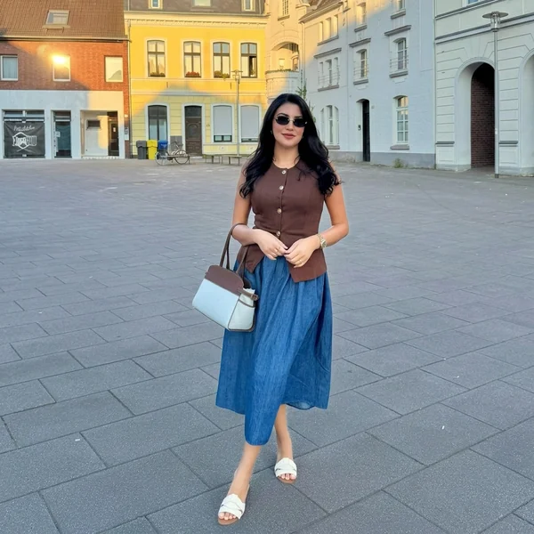Brown Sleeveless Vest with Blue Flowing Midi Skirt