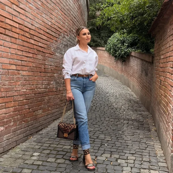 White Button-Down Shirt and Cuffed Denim with Studded Sandals