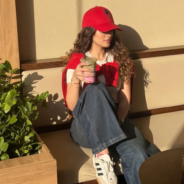 Red Accents and Wide-Leg Denim with Sambas