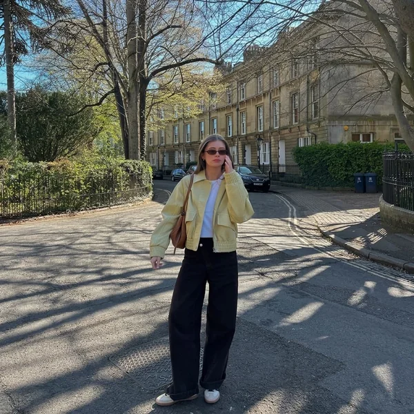 Pastel Yellow Bomber and Wide-Leg Black Pants with Sambas