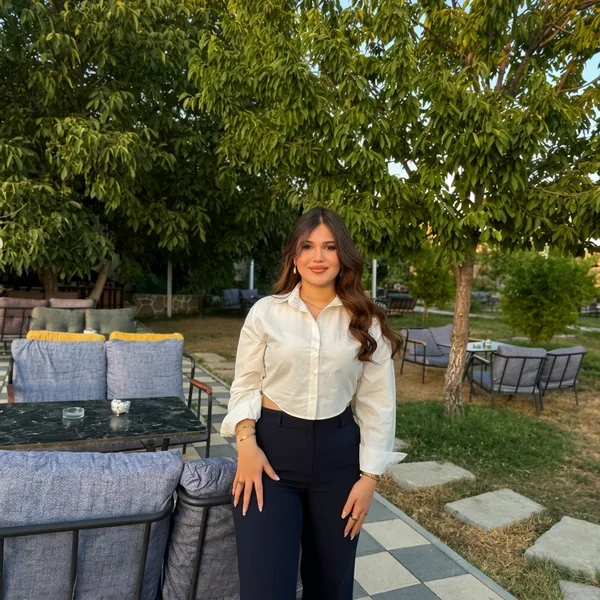 Cropped white button down with high waisted trousers outfit
