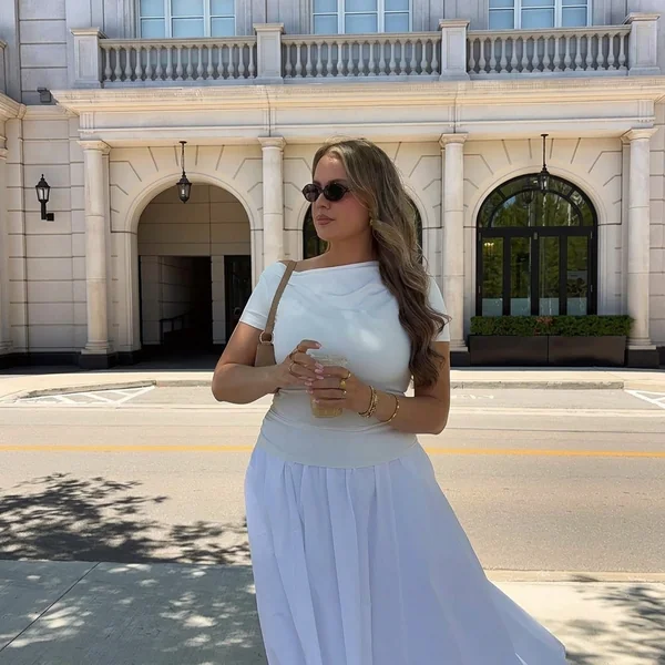 Draped white top with flowy midi skirt outfit