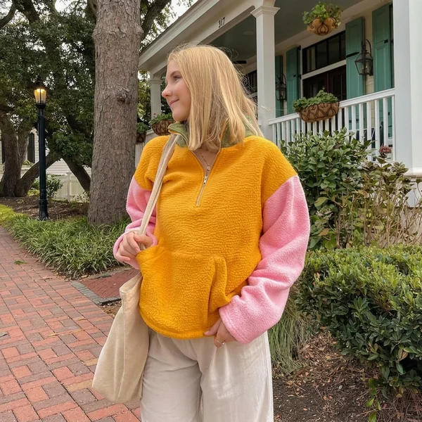 Color-Block Fleece Pullover & Cream Trousers