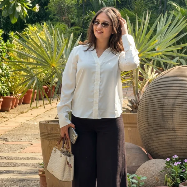 White V neck button down with black wide leg trousers