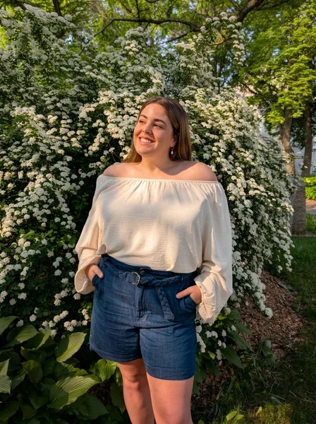 Off-the-Shoulder Cream Blouse with High-Waisted Denim Shorts
