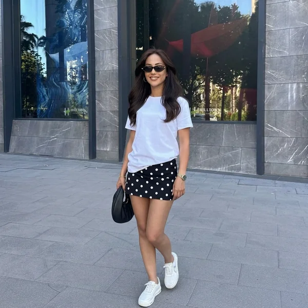 White crewneck top with polka dot mini skirt outfit