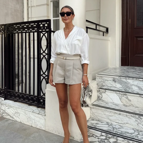 White shirt with tailored beige shorts outfit